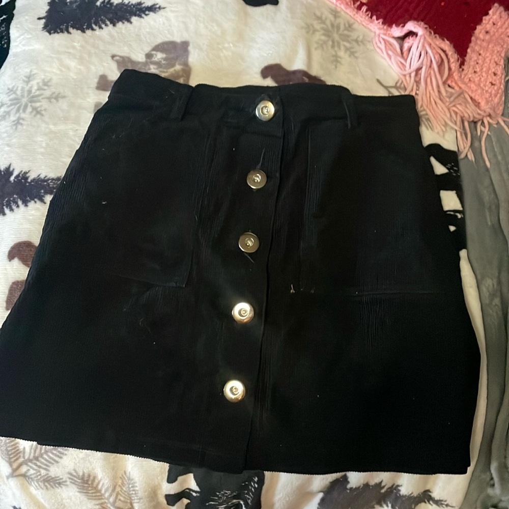 Corduroy black button up skirt. With pockets and belt loops, size small